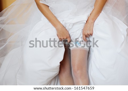 Piece of the women\'s leg, of bride gearing up to her marriage ceremony.