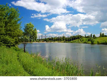 summer landscape with river, clouds and trees