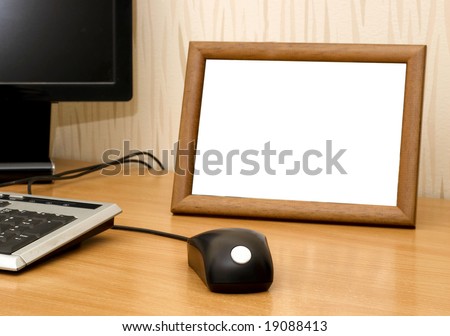 Empty photo frame on computer table