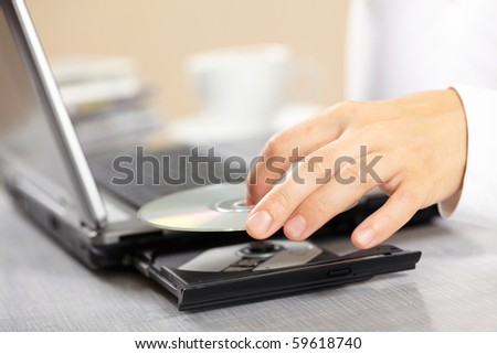 Woman hand with CD