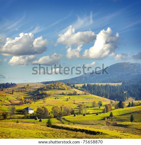 Landscape with village, mountains and blu sky