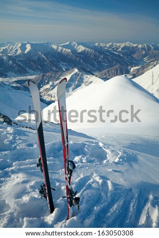 Pair of cross skis in snow,  in the mountains