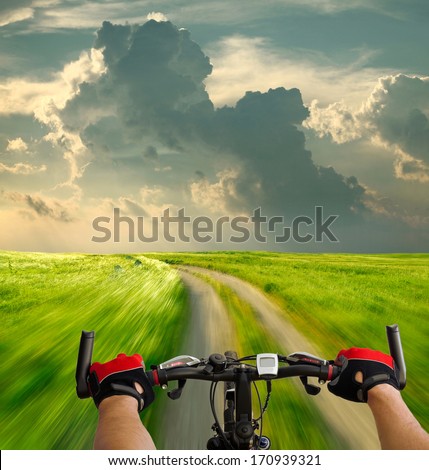 Man With Bicycle Riding Country Road