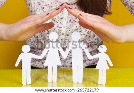 Two Woman\'s open hands making a protection gesture with isolated on green background.Family life insurance, protecting family, family concepts.