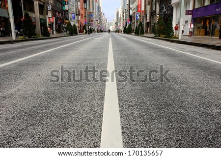 TOKYO, JAPAN - OCTOBER 26 : The center road  empties of traffic  in the week-end, no cars parks for the people can be buy free  on October 26,2013 in Tokyo, Japan.