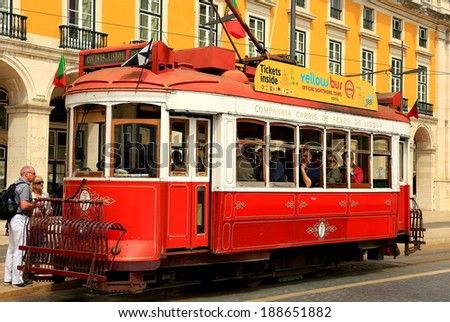 LISBON,PORTUGAL-APRIL 12, 2014: Tourists goes up to the tram in the center of Lisbon on April 12, 2014 in Portugal.