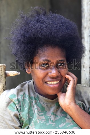 PENTECOSTES,VANUATU-OCTOBER 12, 2014: Local woman with afro hair hairdressing expected turn in the village on October 12, in Pangi-Vanuatu.