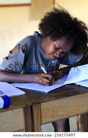 AMBRYM,VANUATU-OCTOBER 11, 2014: Young student preparing exams in school community on October 11, in Harimal-Vanuatu.
