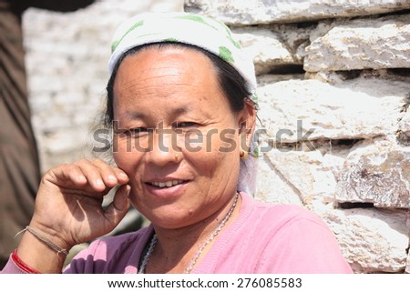 NEPAL-OCTOBER 09, 2012: Mongolian woman invites tourists to visit home on October 09, Nepal.