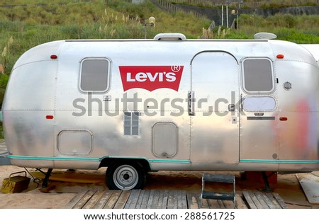 BIARRITZ, FRANCE-JULY 19, 2014: Retro van shows advertising logo near the beach on July 19, in Biarritz-France.