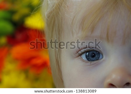 beautiful children\'s eyes blurred background flowers