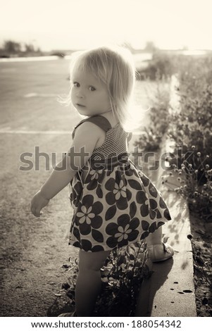 little girl near the road, black and white photography