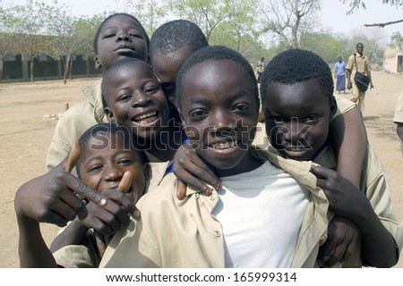 KOUPELA, BURKINA FASO - FEBRUARY 20 : A small group of pupil of the college Saint-Philippe have fun much to be photographed together, February 20, 2007