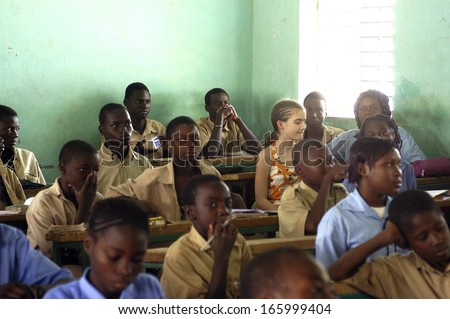 KOUPELA - BURKINA FASO - FEBRUARY 26, 2007: Visit of French schoolboy in Africa with the college Saint-Philippe. The pupils are in of a the same class level than in their French school.