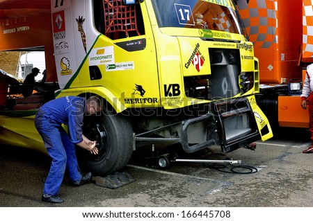 ALES, FRANCE - MAY 25: Grand Prix trucks on the circuit mechanical pole. A mechanic works on the truck Olivier, may 25, 2013