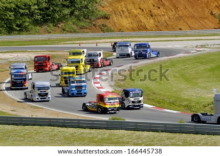 ALES, FRANCE - MAY 25: Grand Prix trucks on the circuit mechanical pole.  Trucks leave for a warm-up lap and a flying start on the grid, may 25, 2013