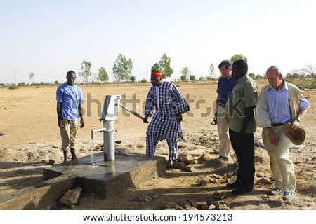 LIGUIDIMALGEM, BURKINA FASO - FEBRUARY 27: pump in Burkina Faso. The leaders of the association and the village chief innaugurent all the new pump, February 27, 2007