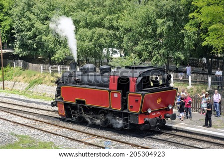 ANDUZE, FRANCE - JULY 14 : The steam locomotive tourist train from Anduze receding to hang cars and from Saint-Jean-du-Gard, July 14, 2014.