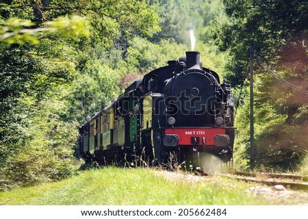 MASSIES, FRANCE - JULY 15: The tourist train from Anduze in the countryside arriving at Massies where he does not stop, july 15, 2014.