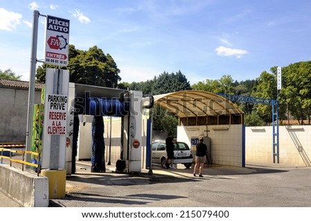 ANDUZE, FRANCE - AUGUST 24 : Car wash where customers themselves wash their cars with high-pressure jets free service, august 24, 2014.
