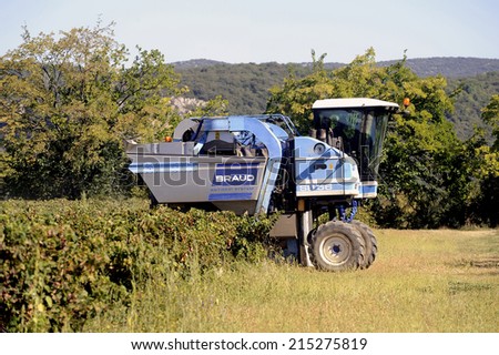 TORNAC, FRANCE - SEPTEMBER 2: The harvest with machines to harvest the grapes in France in the department of Gard, september 2, 2014.