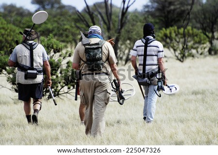 AUSTRALIA - MAY 6: Departure of a small group of gold miners equipped with metal detectors and picks at dawn looking for gold nuggets, may 6, 2007.
