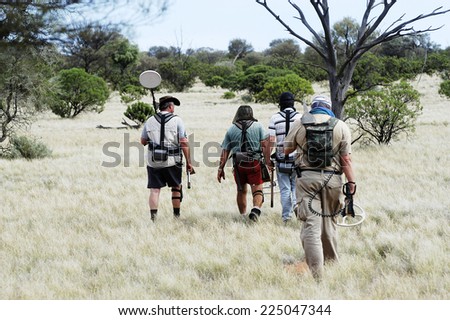 AUSTRALIA - MAY 6: Departure of a small group of gold miners equipped with metal detectors and picks at dawn looking for gold nuggets, may 6, 2007.
