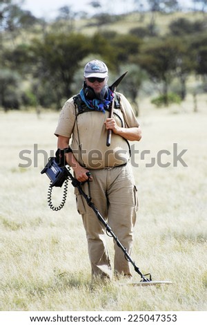 AUSTRALIA - MAY 6: Gold miner in the Australian outback prospecting area in the bush with his metal detector looking for gold nuggets, may 6, 2007.
