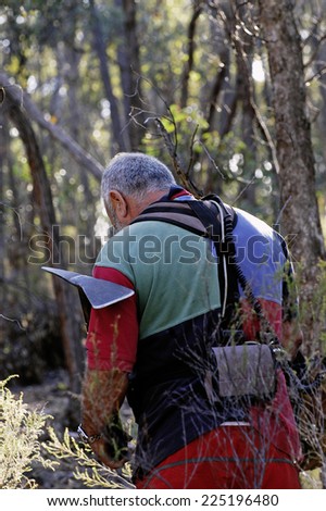 AUSTRALIA - APRIL 23: Gold miner at work detecting gold nuggets with a metal detector., April 23, 2007