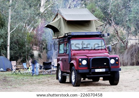 AUSTRALIA - APRIL 21: All-terrain vehicle equipped for camping with a tent on the roof handy for sleep safely, April 21, 2007.