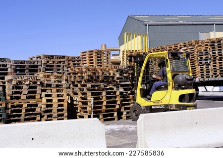 AIGUES-MORTES, FRANCE - SEPTEMBER 1: handling and storage of pallets in a warehouse awaiting reuse for transporting goods, september 1, 2014.