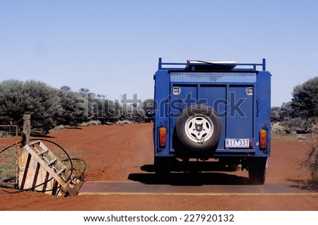 AUSTRALIA - MAY 11: An all-terrain vehicle with a trailer on a big track in the outback, may 11, 2007.