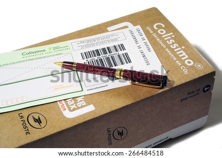 TORNAC, FRANCE - MARCH 23: Mailing carton sold by the French Post for sending in France and followed by bar code with an insurance in case of loss, march 23, 2015.