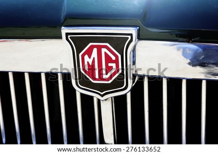 ALES, FRANCE - APRIL 11: Detail of the MG brand on an old car radiator photographed vintage car rally Town Hall Square in the town of Ales, in the Gard department, April 11, 2015.
