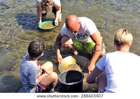 CARDET, FRANCE - MAY 25: Gold prospectors of all ages on the banks of the Gardon River Gard French gold coming down from the Cevennes, may 25, 2015.