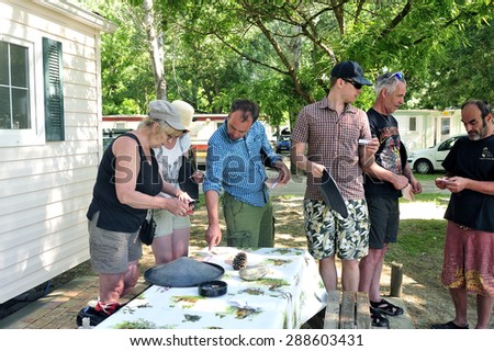 CARDET, FRANCE - MAY 25: Treasure hunt organized in a French campsite to amuse and occupy campers. Participants must find the envelopes containing the indices, may 25, 2015.