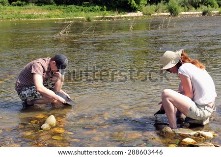 CARDET, FRANCE - MAY 25: Gold prospectors of all ages on the banks of the Gardon River Gard French gold coming down from the Cevennes, may 25, 2015.