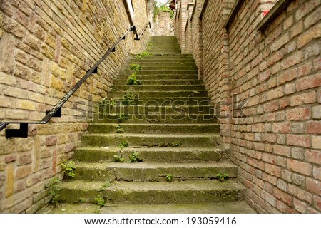 Classic old steps with brick wall