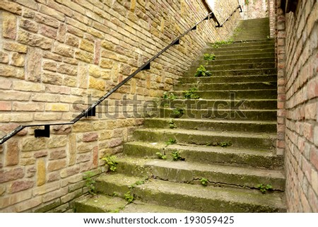 Classic old steps with brick wall