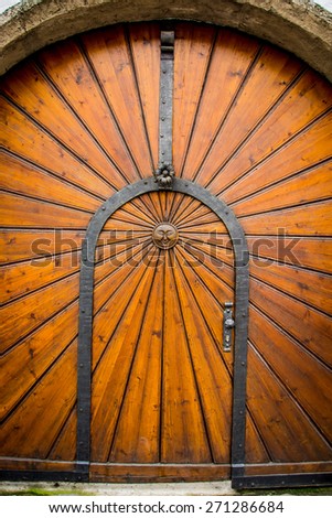 Wood door with sun symbol
