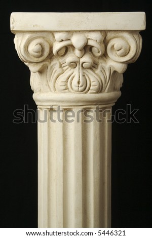 Ancient Column Pillar Replica on a Black Background.