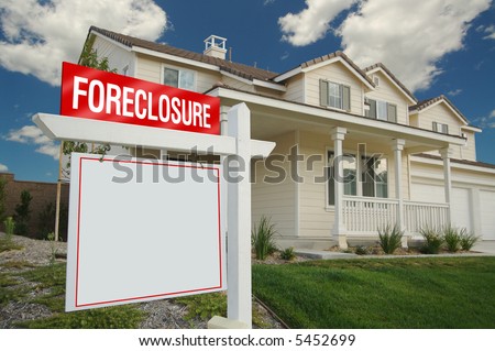 Blank Foreclosure Sign and House with dramatic sky background. Ready for your own message.