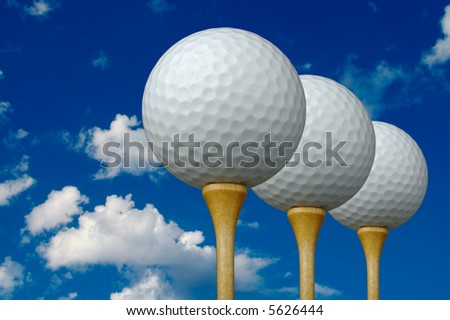 Three Golf Balls & Tees on the right with clouds and sky background.