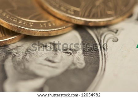 Abstract of the new U.S. Dollar coin on Dollar Bills with Narrow Depth of Field.