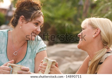 Two Girlfriends Enjoy A Casual Conversation