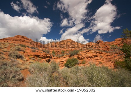 Red Rocks of Utah with Dramatic Blue Sky and Clouds