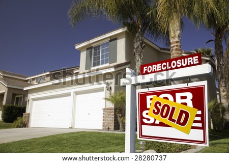 Red Foreclosure For Sale Real Estate Sign in Front of House.