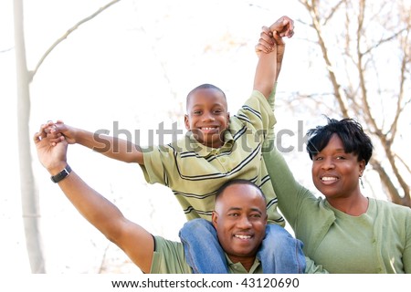 African American Family Having Fun in the Park.