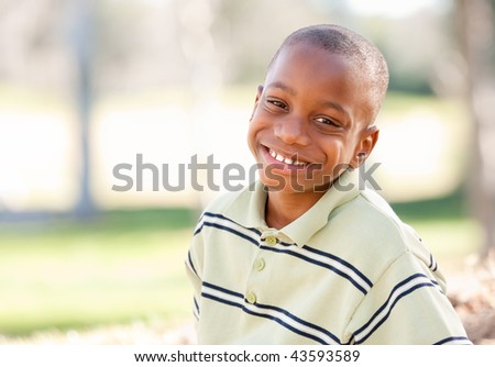 Happy Young African American Boy In The Par