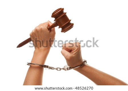 stock photo Handcuffed Woman Holding Wooden Gavel in Her Fist Isolated on 
